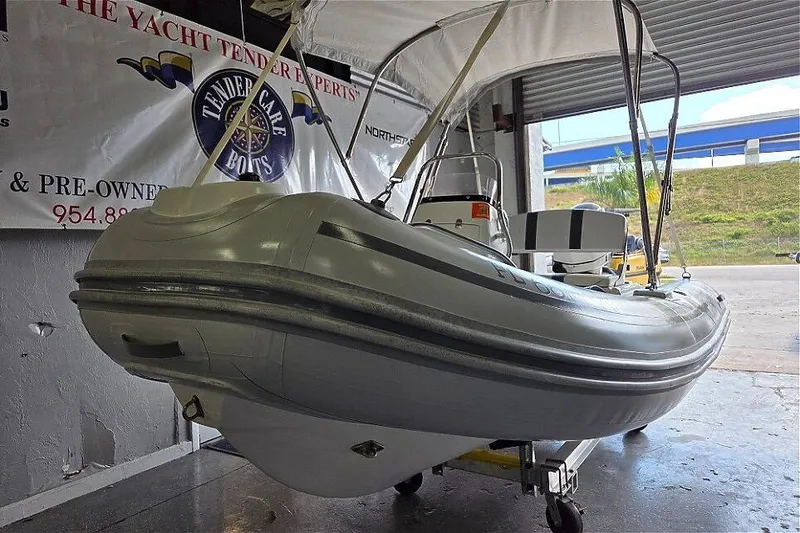 Slide: The Image of 2015 AB Inflatables Oceanus 12 VST interior with Evinrude 40HP, featuring gray seating. - 8