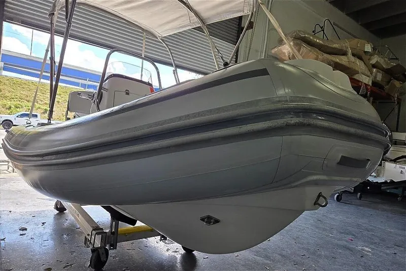 Slide: The Image of 2015 AB Inflatables Oceanus 12 VST with Evinrude 50HP in storage. - 10