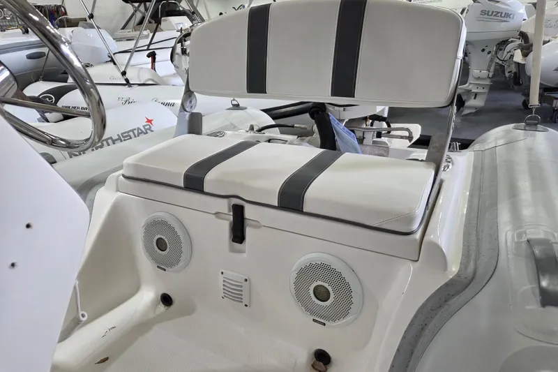 Slide: The Image of 2015 AB Inflatables Oceanus 12 VST boat dashboard with steering wheel and controls. - 12
