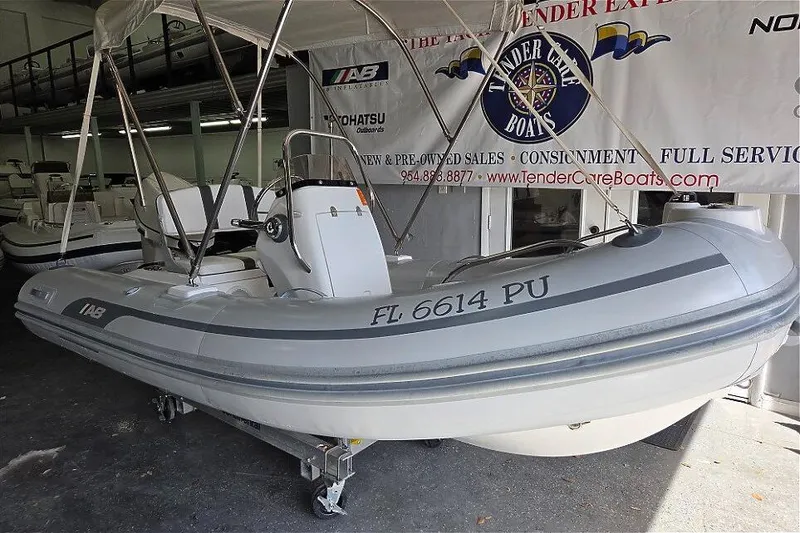 Slide: The Image of 2015 AB Inflatables Oceanus 12 VST with Evinrude 50HP, displayed indoors. - 3