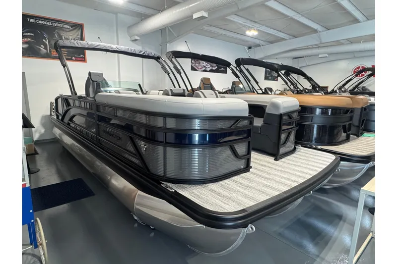 The Image of 2026 Bennington 22 SSB Sport pontoon boat displayed in a showroom. - 1