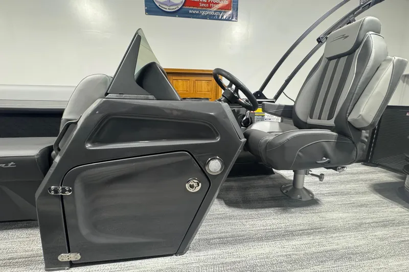 Slide: The Image of 2026 Bennington 22 SSB Sport boat interior with sleek steering console and comfortable seating. - 10