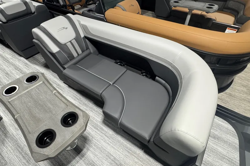 Slide: The Image of 2026 Bennington 22 SSB Sport boat interior with luxurious seating and cup holders. - 4