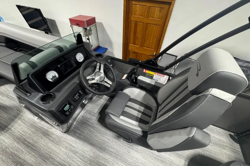 Slide: The Image of 2026 Bennington 22 SSB Sport boat interior with steering wheel and seating. - 7