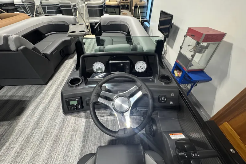 Slide: The Image of Interior view of 2026 Bennington 22 SSB Sport boat with modern dashboard and seating. - 8