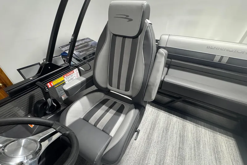 Slide: The Image of 2026 Bennington 22 SSB Sport boat interior with sleek gray seating and modern controls. - 9