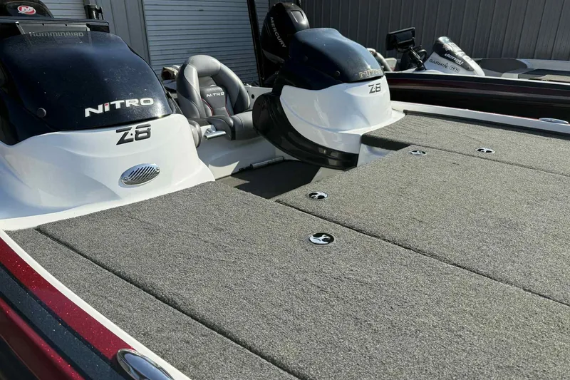 Slide: The Image of 2014 Nitro Z-8 boat with carpeted deck and dual seats. - 11