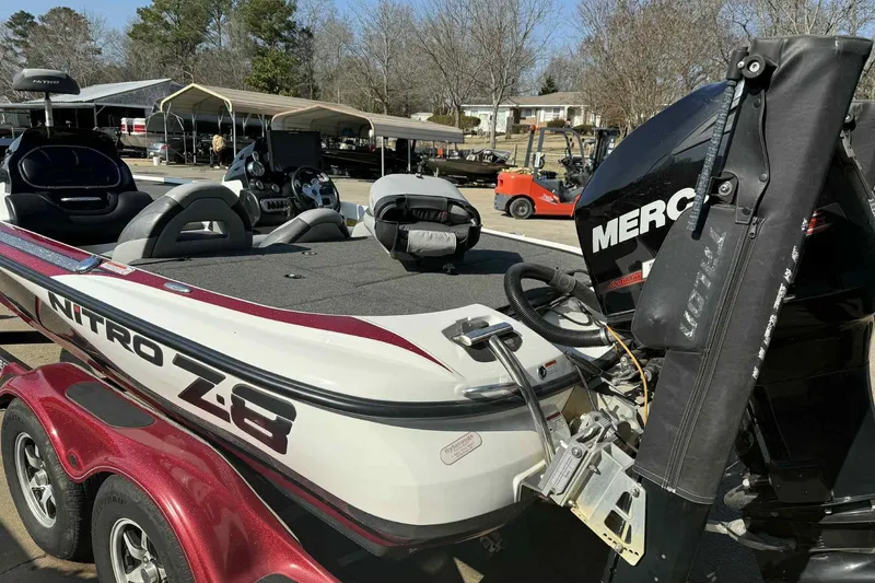 Slide: The Image of 2014 Nitro Z-8 boat with Mercury engine, parked outdoors on a trailer. - 6