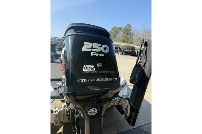 Slide: The Image of 2014 Nitro Z-8 boat with 250 Pro outboard motor, parked outdoors. - 8