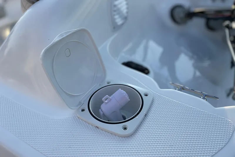 Slide: The Image of Open compartment on Caribe DL12 boat, 2026 model, showing interior details. - 5