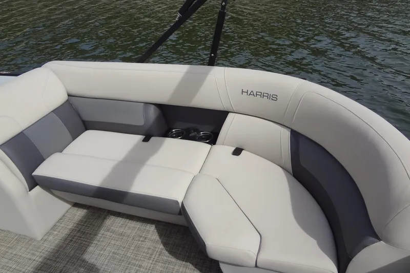 Slide: The Image of 2022 Harris FloteBote 230 Cruiser interior seating with elegant design on water. - 16