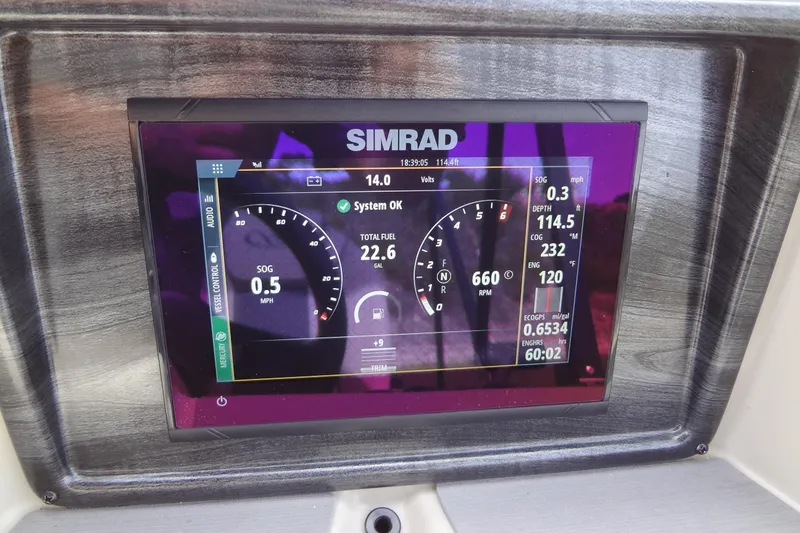 Slide: The Image of Simrad display on 2022 Harris FloteBote 230 Cruiser showing speed, depth, and engine data. - 21