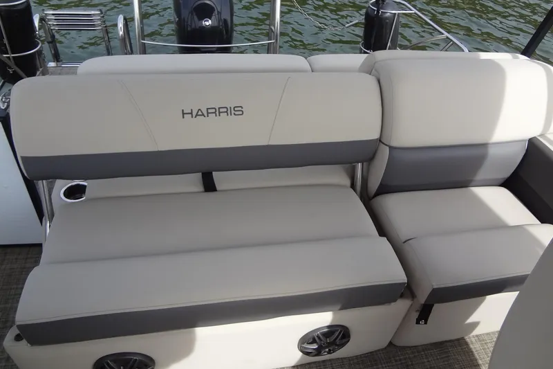 Slide: The Image of 2022 Harris FloteBote 230 Cruiser boat seating with gray and white upholstery. - 23