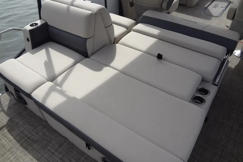 Slide: The Image of 2022 Harris FloteBote 230 Cruiser interior with spacious, comfortable seating and cup holders. - 24