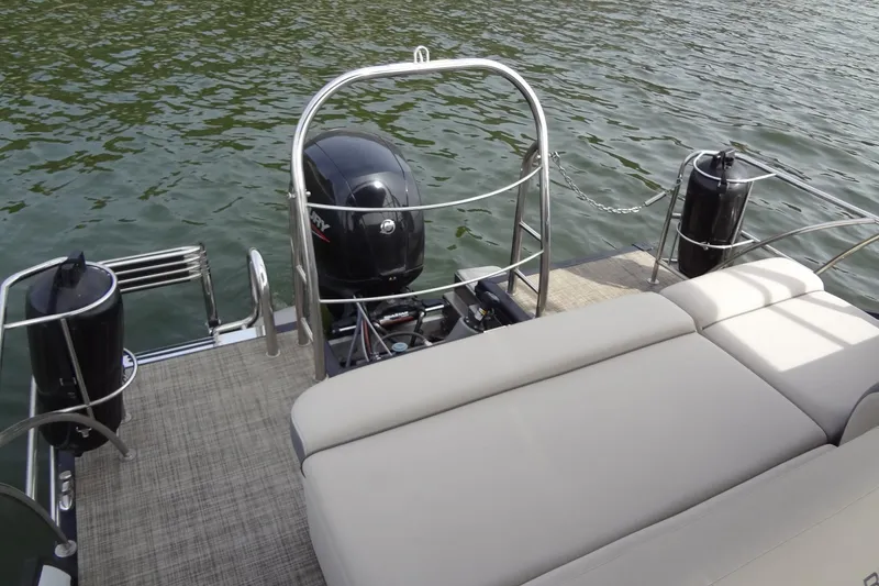 Slide: The Image of 2022 Harris FloteBote 230 Cruiser pontoon boat with Mercury outboard motor on a lake. - 26