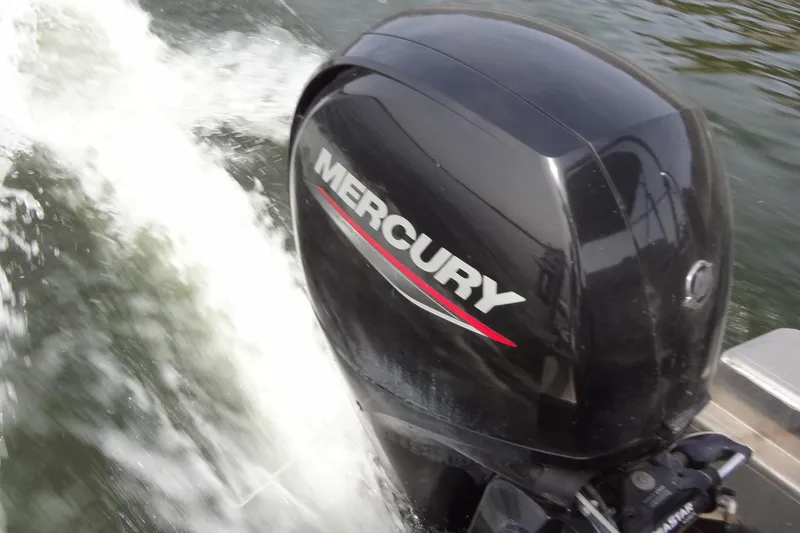Slide: The Image of Mercury outboard motor powering 2022 Harris FloteBote 230 Cruiser on water. - 28