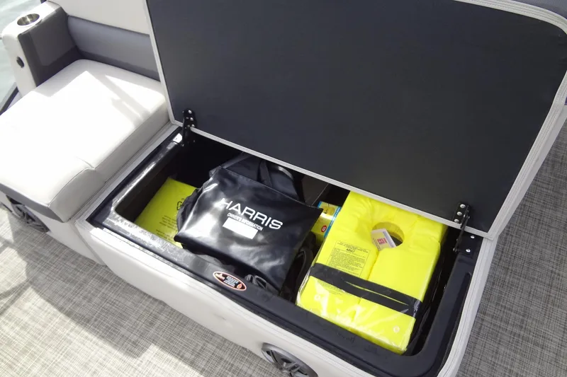 Slide: The Image of Storage compartment on 2022 Harris FloteBote 230 Cruiser with life jackets and gear. - 29