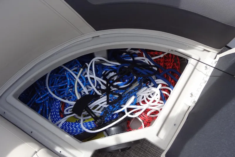 Slide: The Image of Storage compartment with colorful ropes on a 2022 Harris FloteBote 230 Cruiser. - 35