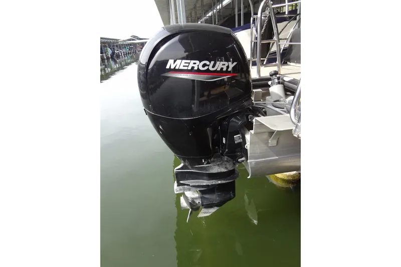 Slide: The Image of Mercury outboard motor on 2022 Harris FloteBote 230 Cruiser, docked in marina. - 48