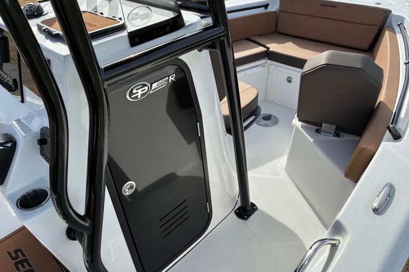 Slide: The Image of 2026 Sea Pro 225FLX Sandbar boat interior with seating and storage. - 14