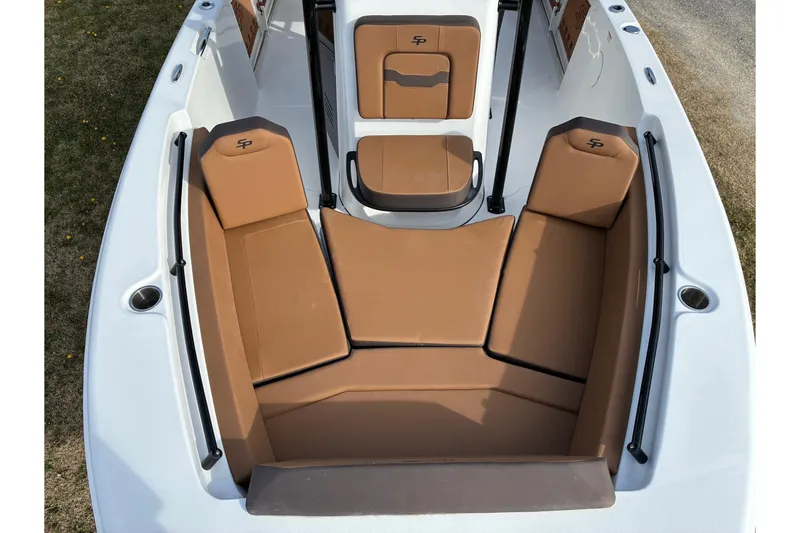 Slide: The Image of 2026 Sea Pro 225FLX Sandbar boat interior with tan cushioned seating. - 16