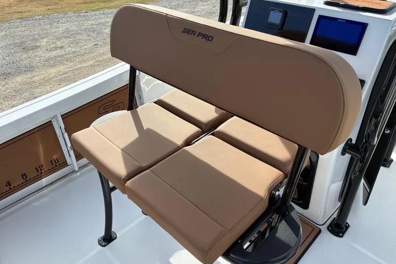 Slide: The Image of 2026 Sea Pro 225FLX Sandbar boat with tan seating and modern console design. - 9