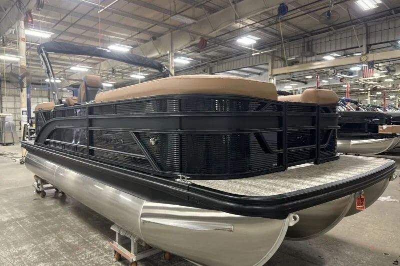 The Image of 2026 Bennington 22 SSR Luxe pontoon boat in a factory setting. - 1