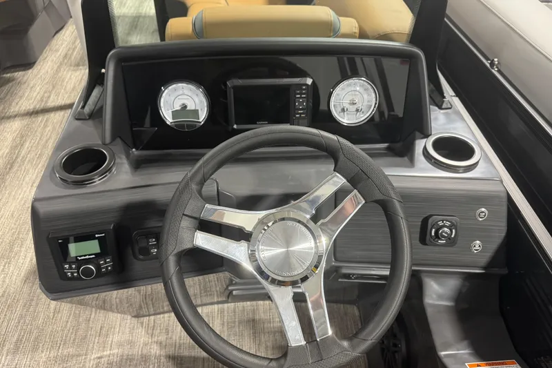 Slide: The Image of 2026 Bennington 22 SSR Luxe boat dashboard with steering wheel and gauges. - 10