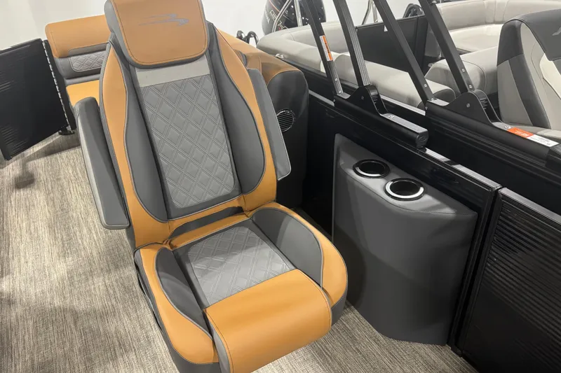 Slide: The Image of Luxurious seating in the 2026 Bennington 22 SSR Luxe boat with cup holders. - 12