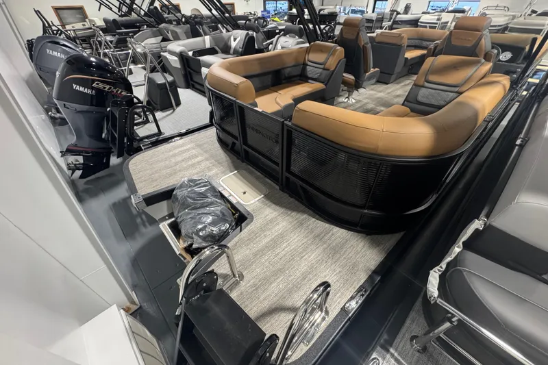 Slide: The Image of 2026 Bennington 22 SSR Luxe pontoon boat with luxurious seating and Yamaha outboard motor. - 20