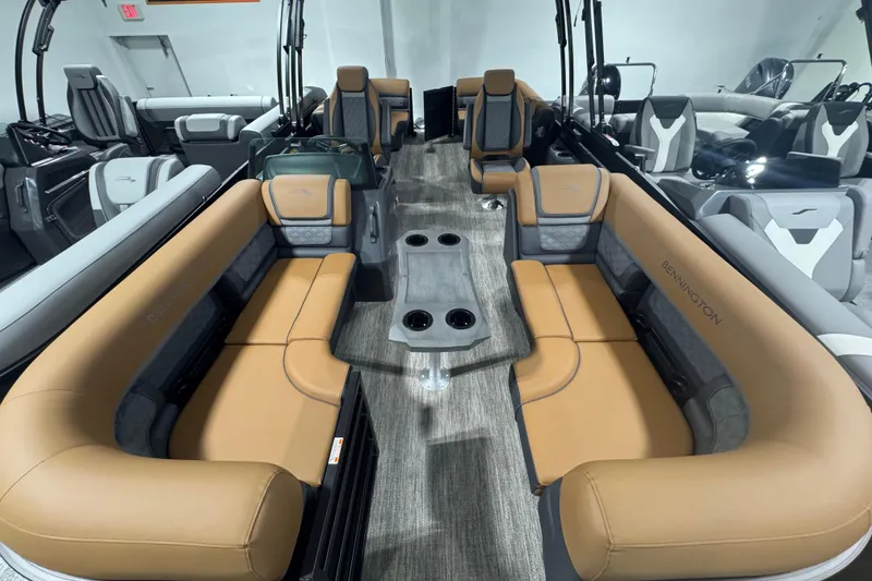 Slide: The Image of 2026 Bennington 22 SSR Luxe pontoon boat interior with luxurious tan seating and modern design. - 3