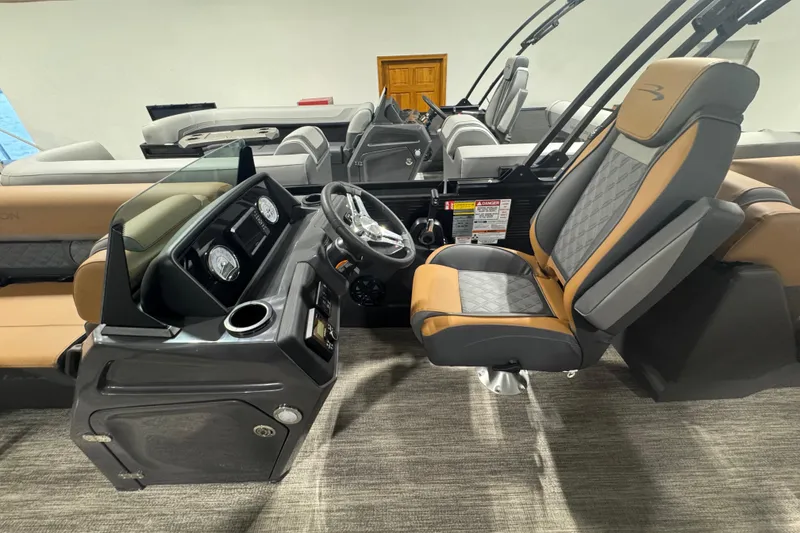 Slide: The Image of 2026 Bennington 22 SSR Luxe boat interior with modern dashboard and luxurious seating. - 9