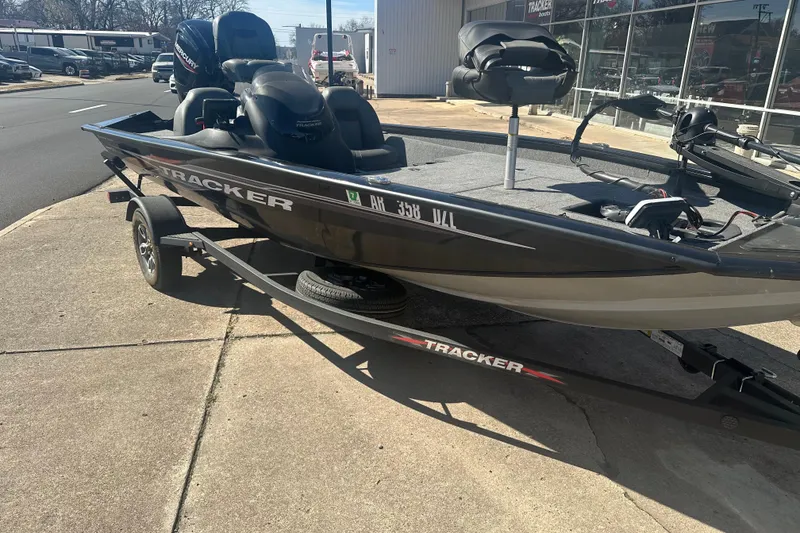 Slide: The Image of 2024 Tracker Pro Team 175 TXW fishing boat on trailer, parked outside dealership. - 3
