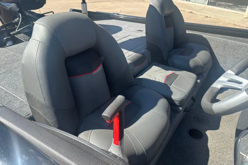 Slide: The Image of 2024 Tracker Pro Team 175 TXW boat interior with gray and red seats. - 8