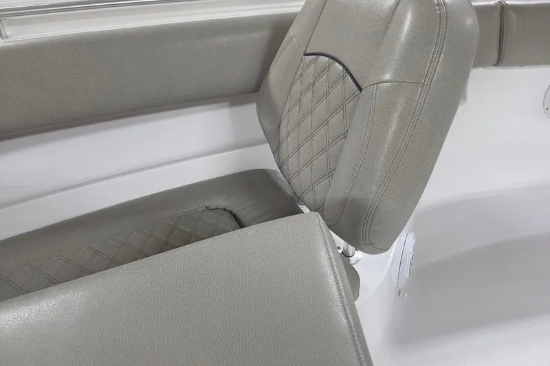 Slide: The Image of 2022 Sportsman Open 322 Center Console boat seat with gray upholstery and diamond stitching. - 10