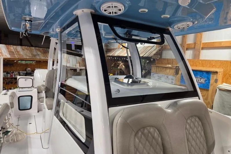 Slide: The Image of 2022 Sportsman Open 322 Center Console interior with seating and helm station. - 22