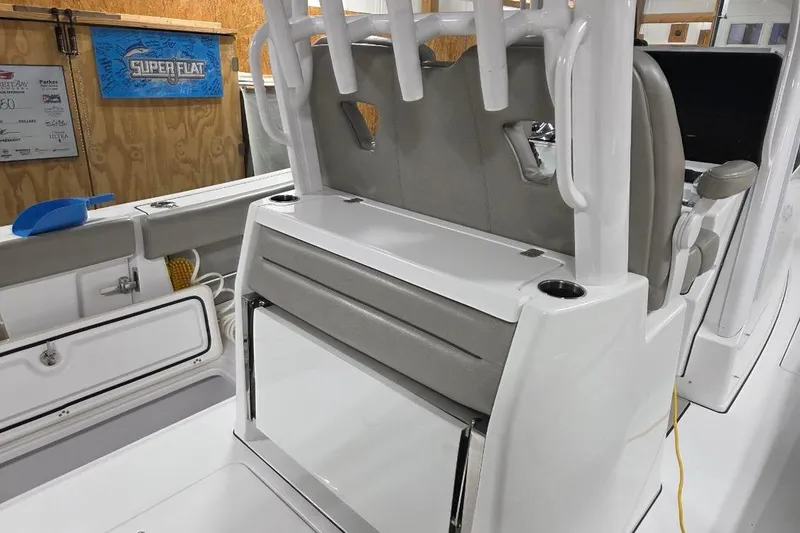Slide: The Image of 2022 Sportsman Open 322 Center Console interior with seating and storage features. - 25