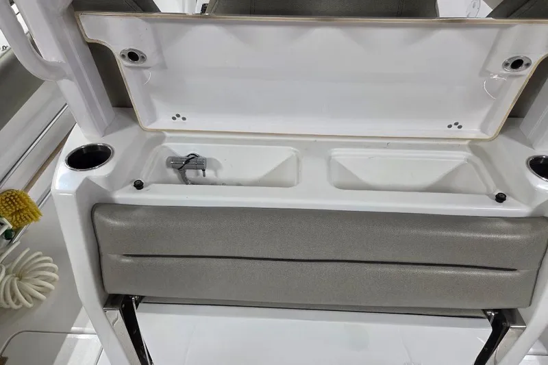 Slide: The Image of 2022 Sportsman Open 322 Center Console interior with seating and storage compartments. - 27