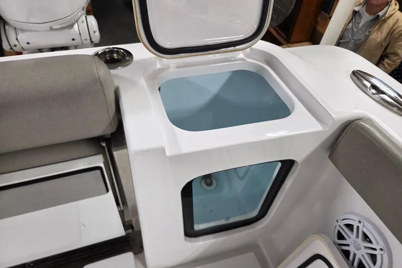 Slide: The Image of 2022 Sportsman Open 322 Center Console boat interior with seating and storage compartments. - 30