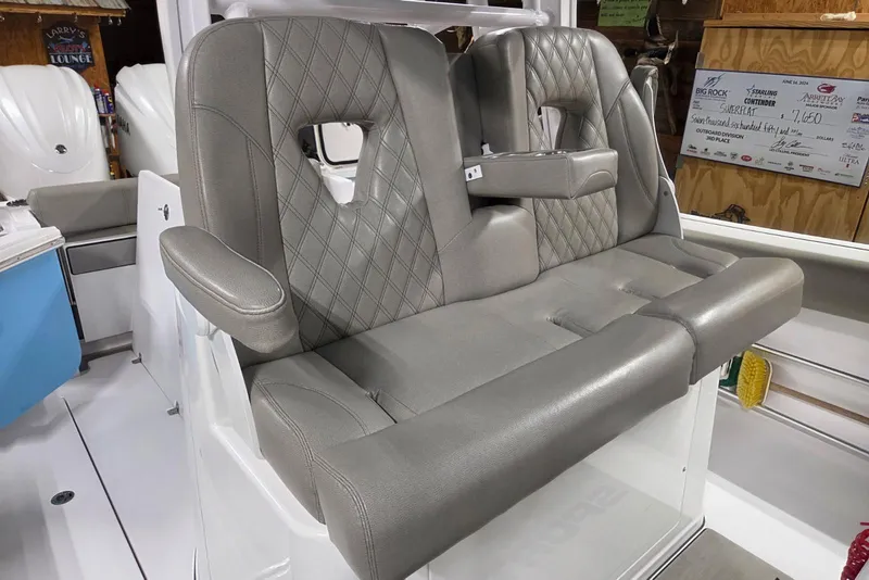 Slide: The Image of 2022 Sportsman Open 322 Center Console boat with luxurious gray seating. - 9