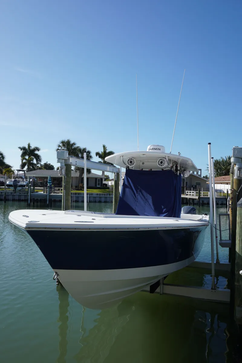 Slide: The Image of 2005 Regulator 32 Forward Seating boat docked in marina. - 30