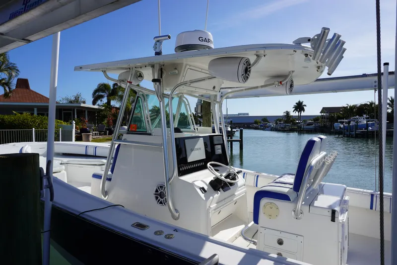 Slide: The Image of 2005 Regulator 32 boat with modern features by the water. - 32