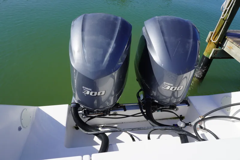 Slide: The Image of Two Yamaha 300 outboard engines on a 2005 Regulator 32 boat. - 36
