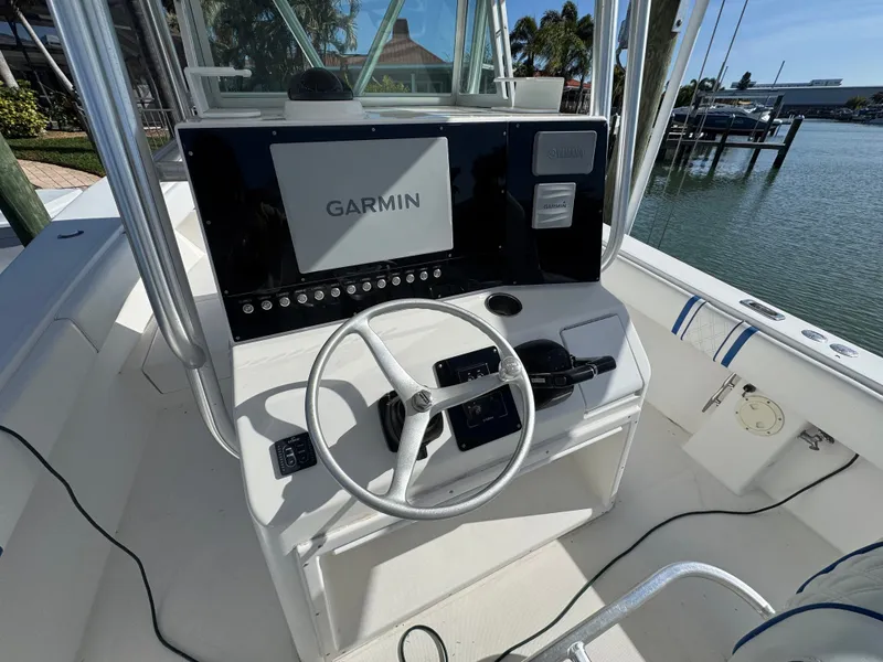 Slide: The Image of 2005 Regulator 32 boat helm with Garmin navigation system. - 40