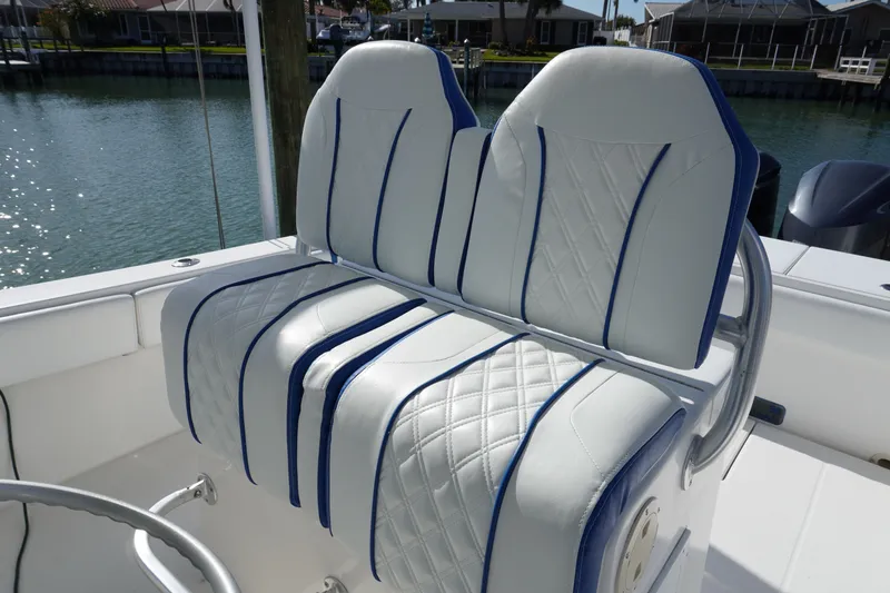 Slide: The Image of Regulator 32 boat seating with blue stitching, year 2005. - 44