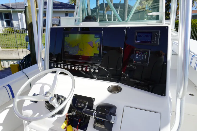 Slide: The Image of Helm console of a 2005 Regulator 32 Forward Seating boat. - 46