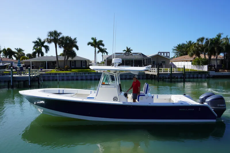 Slide: The Image of 2005 Regulator 32 Forward Seating boat on calm water. - 7