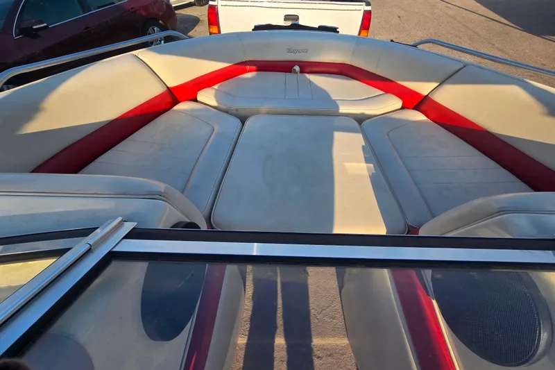 Slide: The Image of Interior of a 1997 Bryant 182 boat with red and beige seating. - 10