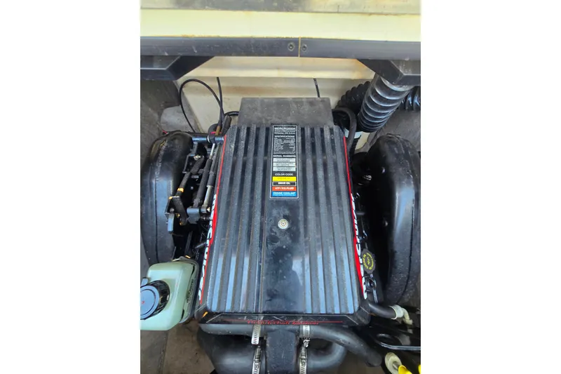 Slide: The Image of Engine compartment of a 1997 Bryant 182 boat, showcasing mechanical components. - 7