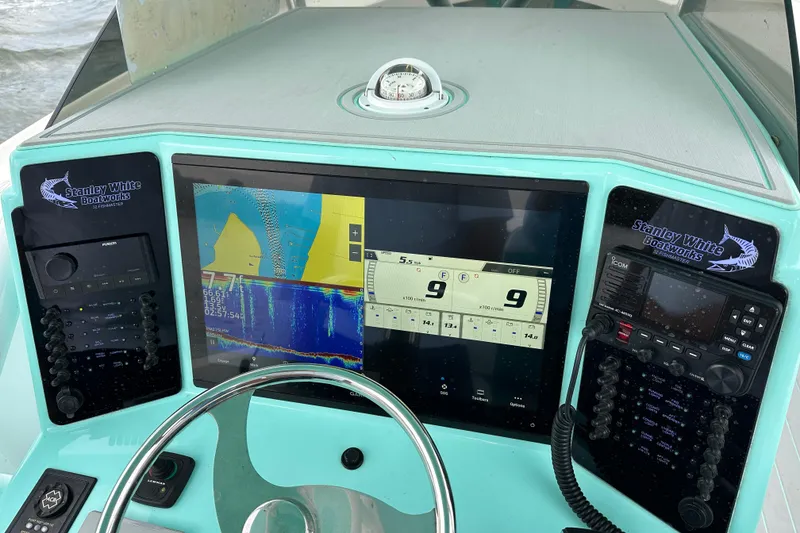 Slide: The Image of Dashboard of 2026 Stanley White Fishmaster boat with navigation and communication systems. - 5